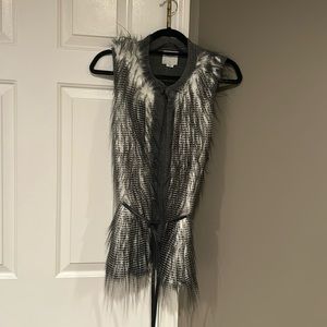 Funky faux fur sweater vest with pleather tie.